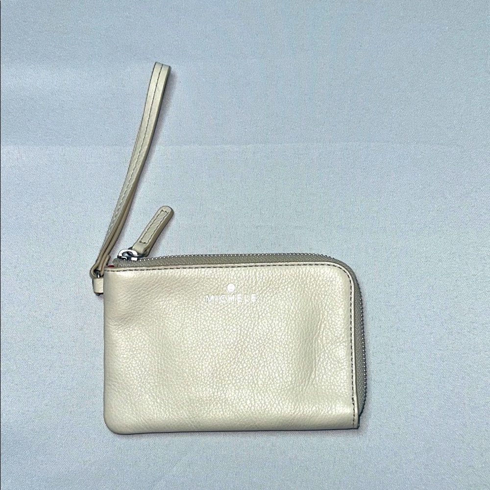EUC• MICHELE• Bone White Leather Wristlet with Red canvas interior.